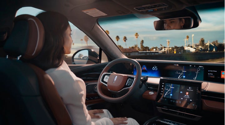 A person is shown driving hands-free on the highway with available Lincoln BlueCruise technology. | Pilson Lincoln in Mattoon IL